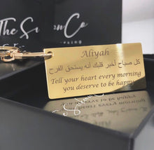 Load image into Gallery viewer, Personalised laser engraved Islamic keychain featuring the quote “Tell your heart every morning you deserve to be happy”, meaningful Muslim gift