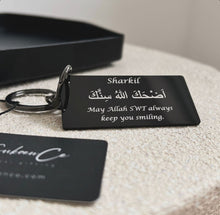 Load image into Gallery viewer, Black laser engraved personalised Islamic keychain with Arabic dua "May Allah SWT always keep you smiling
